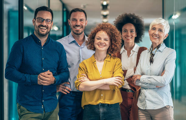 Portrait of Modern multi ethnic business team standing and looking at camera